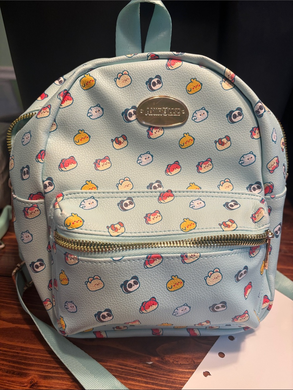 Claire's Light Blue Mini Backpack with Cute Snack Character Print